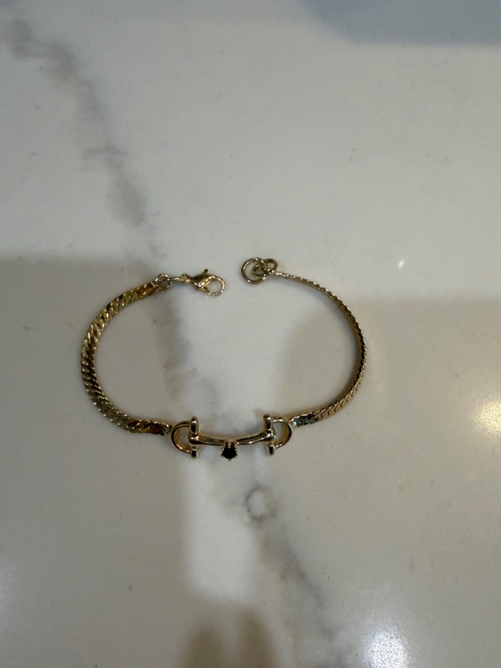 Gold Horsebit Chain Bracelet with Black Stone Accent